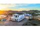 New construction home featuring mountain views, roof tile, and exterior wrap at 3835 W Fox Rd, Laveen, AZ 85339