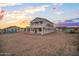 Two-story home under construction with white exterior and scaffolding at 3835 W Fox Rd, Laveen, AZ 85339