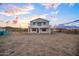 New two-story construction showcasing modern architectural elements against a colorful sky at 3835 W Fox Rd, Laveen, AZ 85339