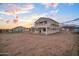 New two-story home exterior in construction, set within a sprawling desert community at 3835 W Fox Rd, Laveen, AZ 85339