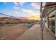 Scenic view of a new construction home from the upper patio framing mountain vistas at 3835 W Fox Rd, Laveen, AZ 85339