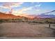Desert landscape featuring mountain views in the distance under a colorful sky at 3835 W Fox Rd, Laveen, AZ 85339