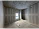 Bathroom under construction featuring a large window and a drywall finish at 4309 E Brook Lynn Pl, San Tan Valley, AZ 85143
