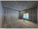 Bright bedroom under construction featuring a large window and drywall at 4309 E Brook Lynn Pl, San Tan Valley, AZ 85143