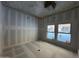 Bright bedroom under construction featuring large windows and a neutral color palette at 4309 E Brook Lynn Pl, San Tan Valley, AZ 85143