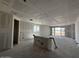 Spacious living room under construction, with large windows and sliding glass doors at 4309 E Brook Lynn Pl, San Tan Valley, AZ 85143