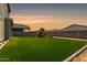 Expansive backyard with artificial turf and playground, ideal for Gathering fun and outdoor activities at 4746 S Orbit St, Mesa, AZ 85212