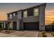 Charming two-story home boasts a modern design, two-car garage, and well-maintained landscaping at 4746 S Orbit St, Mesa, AZ 85212