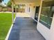 Covered patio with view to artificial grass, block wall, and glass sliding door to the house at 6049 E Glencove St, Mesa, AZ 85205