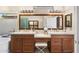 Bathroom with double vanity, stylish fixtures, and well-lit vanity space at 7722 E Hartford Dr, Scottsdale, AZ 85255