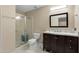 Bathroom with a glass-enclosed shower and marble top vanity at 7722 E Hartford Dr, Scottsdale, AZ 85255
