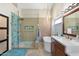 Modern bathroom with glass shower, soaking tub, and stylish fixtures at 7722 E Hartford Dr, Scottsdale, AZ 85255