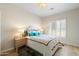 Comfortable bedroom features ample natural light, complemented by a well-sized bed and inviting decor at 7722 E Hartford Dr, Scottsdale, AZ 85255