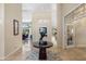 Elegant foyer showcasing tile flooring, high ceilings, and an art display at 7722 E Hartford Dr, Scottsdale, AZ 85255