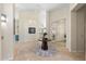 Spacious foyer with tile flooring, art display and bright, airy feel at 7722 E Hartford Dr, Scottsdale, AZ 85255
