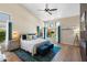 Spacious main bedroom featuring vaulted ceiling, ample windows, and stylish decor at 7722 E Hartford Dr, Scottsdale, AZ 85255
