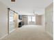 Spacious main bedroom with barn door access to closet, and large window at 7722 E Hartford Dr, Scottsdale, AZ 85255