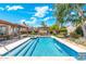 Inviting backyard pool featuring clear blue water, a tanning ledge, and well-manicured landscaping at 7722 E Hartford Dr, Scottsdale, AZ 85255