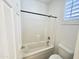 Bright bathroom with tub and shower combination and white subway tile at 1237 E Marcella Ln, Gilbert, AZ 85295