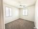 Clean and bright bedroom featuring carpet, ceiling fan, and plantation shutters at 1237 E Marcella Ln, Gilbert, AZ 85295