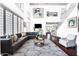 Bright, open living room with a tall ceiling, modern decor, and a staircase visible in the background at 1237 E Marcella Ln, Gilbert, AZ 85295