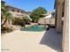 Beautiful backyard swimming pool with rock features and desert landscaping at 17394 W Pima St, Goodyear, AZ 85338