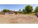 Large backyard offers potential for customization and includes some landscaping elements, and space for various outdoor activities at 19515 E Via Del Palo --, Queen Creek, AZ 85142