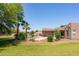 Beautifully landscaped backyard featuring a sparkling pool, mature palm trees, and a cozy pergola for outdoor enjoyment at 19515 E Via Del Palo --, Queen Creek, AZ 85142