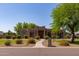 Stunning single-story home featuring lush landscaping and desert-style architecture, creating a welcoming curb appeal at 19515 E Via Del Palo --, Queen Creek, AZ 85142