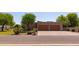 Charming home featuring a well-manicured front yard and a spacious two-car garage, creating an inviting curb appeal at 19515 E Via Del Palo --, Queen Creek, AZ 85142