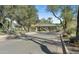 Community entrance with covered gate, desert landscaping, and mountain views in a luxury desert setting at 6556 N Arizona Biltmore Cir, Phoenix, AZ 85016