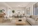 Bright and airy living room featuring hardwood floors, large windows, and an open floor plan at 1112 E Winged Foot Dr, Chandler, AZ 85249