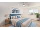 Bright, spacious bedroom with modern furnishings, and hardwood floors at 20815 N 119 Th Ave, Sun City, AZ 85373