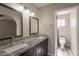 A bathroom features a double sink vanity and a toilet in a separate room at 4906 E Evergreen St, Mesa, AZ 85205