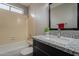 Bathroom with shower-tub combo and vanity with granite countertop at 4906 E Evergreen St, Mesa, AZ 85205