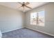 Bedroom with large window and plush carpet at 4906 E Evergreen St, Mesa, AZ 85205