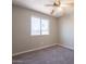 Bedroom with large window and plush carpet at 4906 E Evergreen St, Mesa, AZ 85205