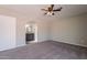 Bedroom features plush carpet and an archway leading to the ensuite bathroom at 4906 E Evergreen St, Mesa, AZ 85205