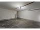 An empty garage features a water heater at 4906 E Evergreen St, Mesa, AZ 85205