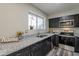 Modern kitchen with granite counters, stainless steel appliances, and ample cabinet space at 4906 E Evergreen St, Mesa, AZ 85205