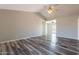 Open living room features wood floors and a ceiling fan at 4906 E Evergreen St, Mesa, AZ 85205