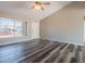 Bright living room features wood floors and a ceiling fan at 4906 E Evergreen St, Mesa, AZ 85205