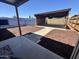 An appealing backyard with a covered parking area and wood fencing at 5120 W Willow Ave, Glendale, AZ 85304