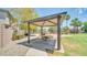Outdoor community picnic area with covered pavilion, picnic table, and view of playground and landscaping at 7533 S 31St Pl, Phoenix, AZ 85042