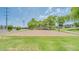 Community volleyball court with net, landscaping, and nearby benches for players and spectators at 7533 S 31St Pl, Phoenix, AZ 85042