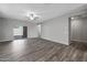 Bright and open living space features wood-look flooring and sliding glass doors at 10323 N 115Th Ave, Youngtown, AZ 85363