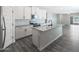 Modern kitchen with white cabinets, granite countertops, and stainless steel appliances at 10341 N 115Th Ave, Youngtown, AZ 85363
