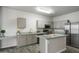 Modern kitchen featuring granite countertops, stainless steel appliances and an island at 10551 W Jessie Ln, Peoria, AZ 85383