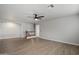 Large loft area featuring wood-look floors, a ceiling fan, and access to the staircase and bedrooms at 10551 W Jessie Ln, Peoria, AZ 85383