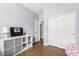 Cozy bedroom with wood-look floors, storage, and a view of the closet and hallway at 10603 E Firewheel Dr, Scottsdale, AZ 85255